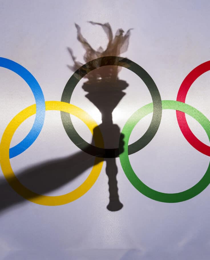 Silhouette hand sport torch flag rings Olympic February 3 2015